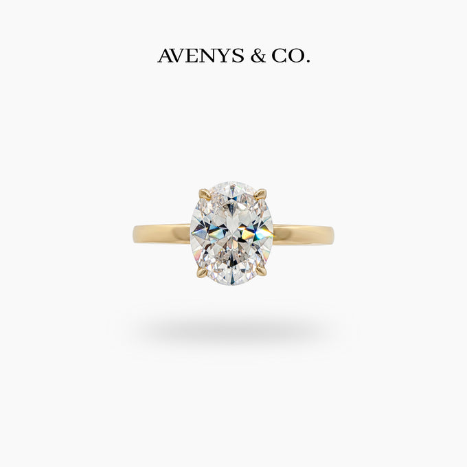 Oval Solitaire Ring with White Oval Stone – on Yellow Gold