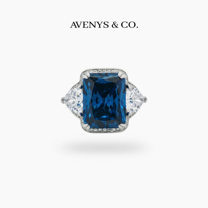 Queens Radiant Ring with Blue Round Stone – on White Gold