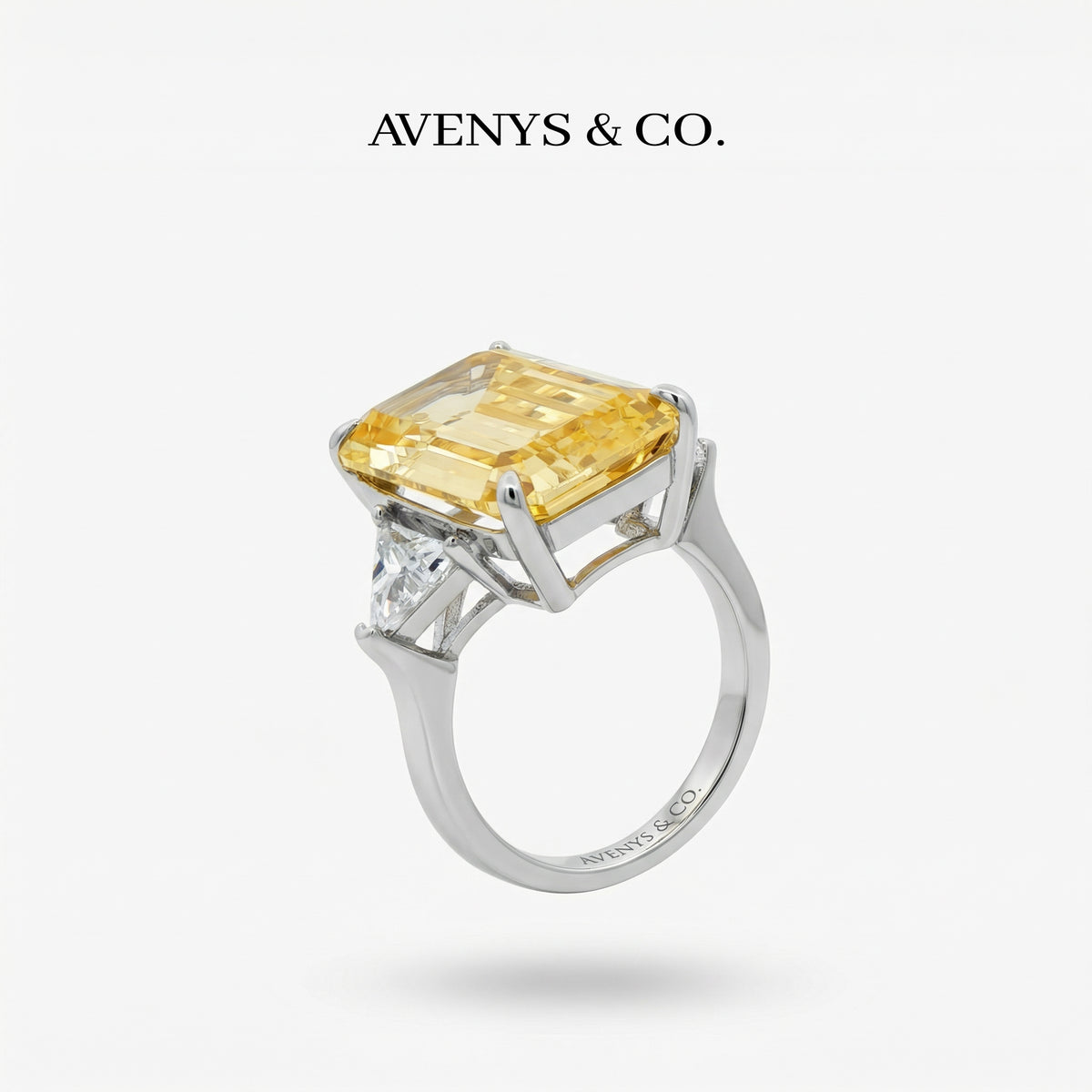 Emerald Trilogy Ring with Yellow Emerald Stone – on White Gold