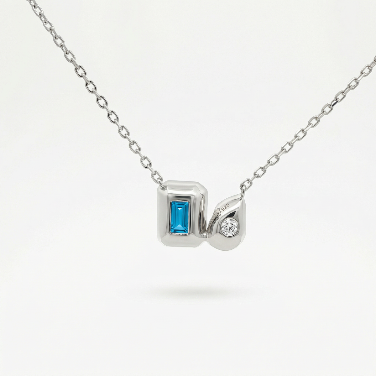 Duality Necklace with Blue Emerald Stone – on White Gold