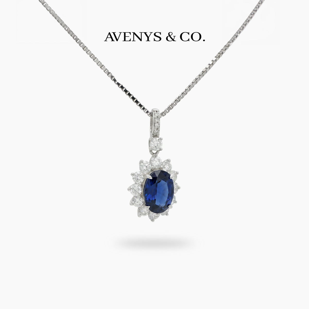 Classic Halo Necklace with Blue Oval Stone – on White Gold