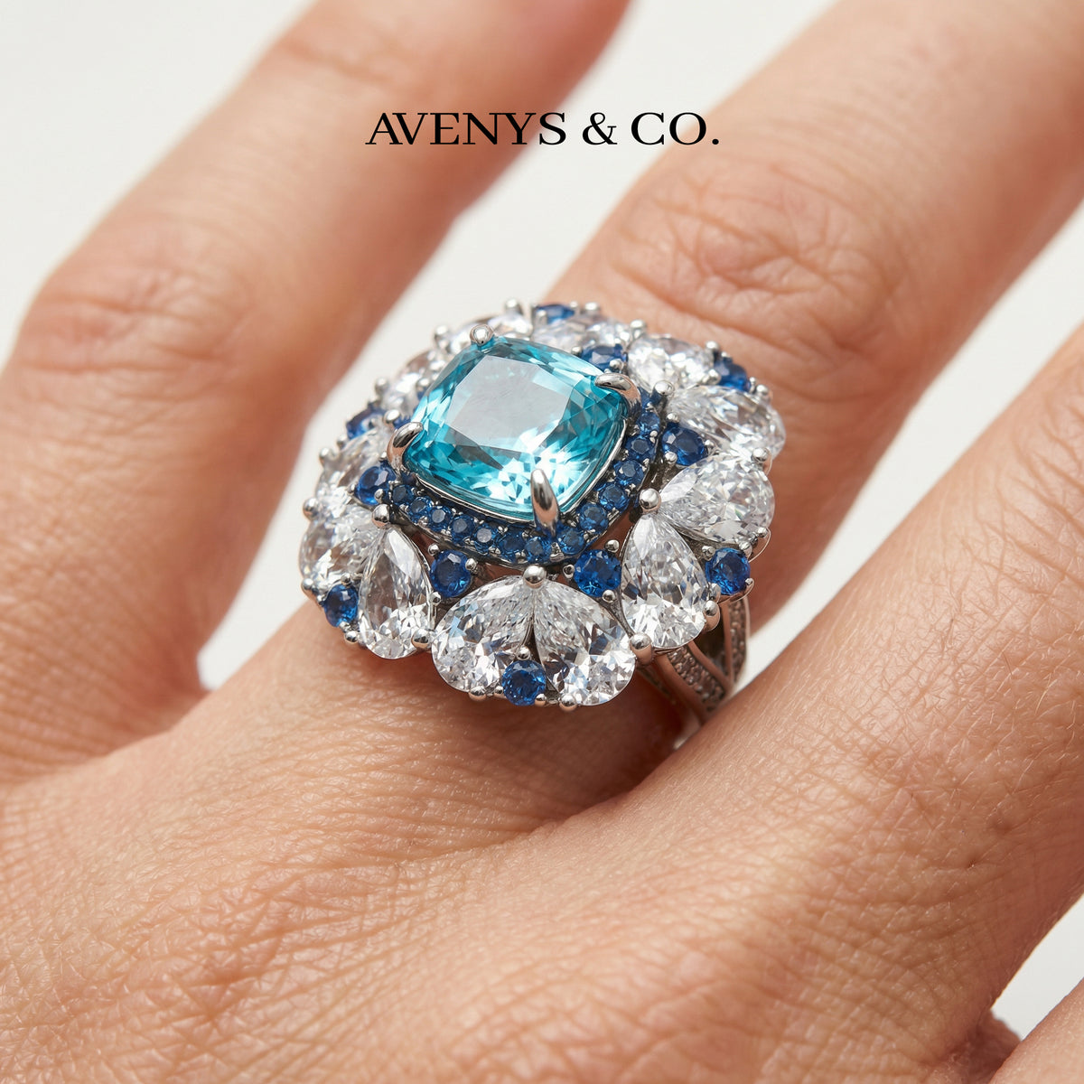 Royal Flower Halo Ring with Blue Cushion Stone – on White Gold