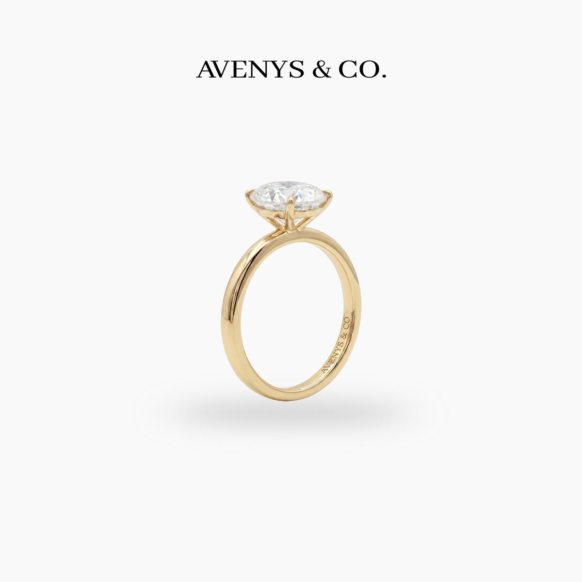 Oval Solitaire Ring with White Oval Stone – on Yellow Gold