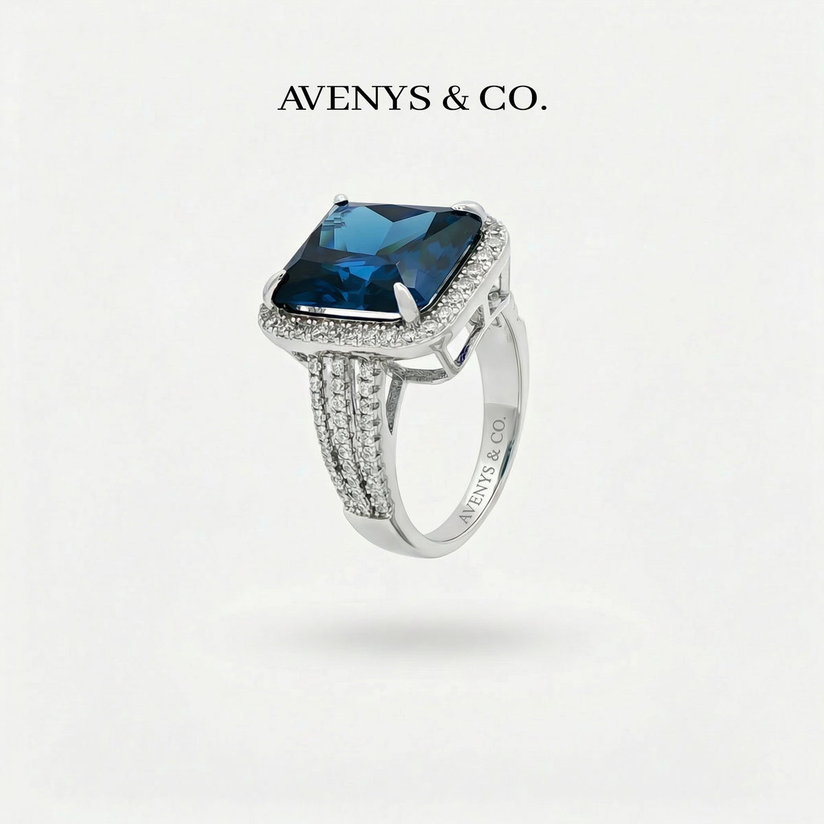 Triple Shank Radiant Ring with Blue Radiant Stone – on White Gold