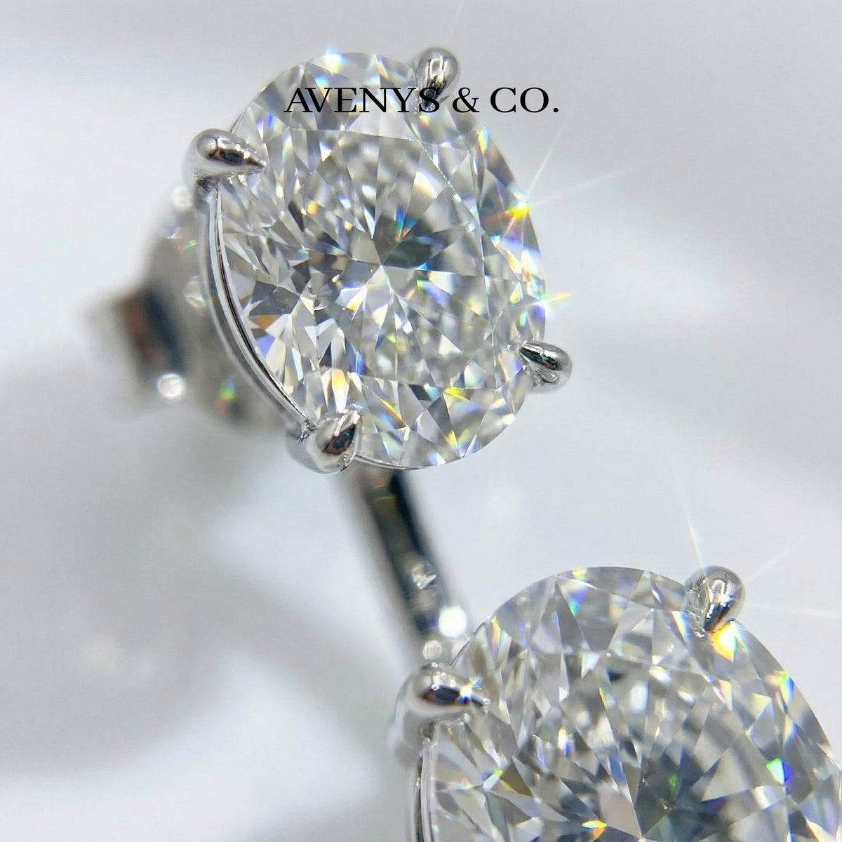 Air Drop Earrings with White Oval Stone – on White Gold