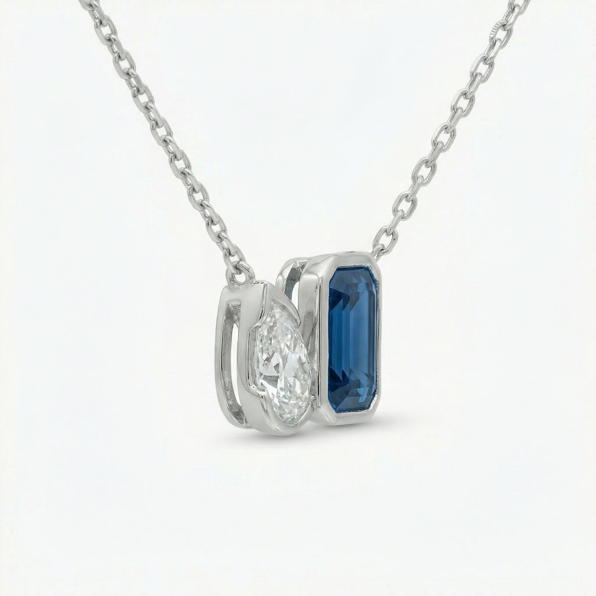 Duality Necklace with Blue Emerald Stone – on White Gold