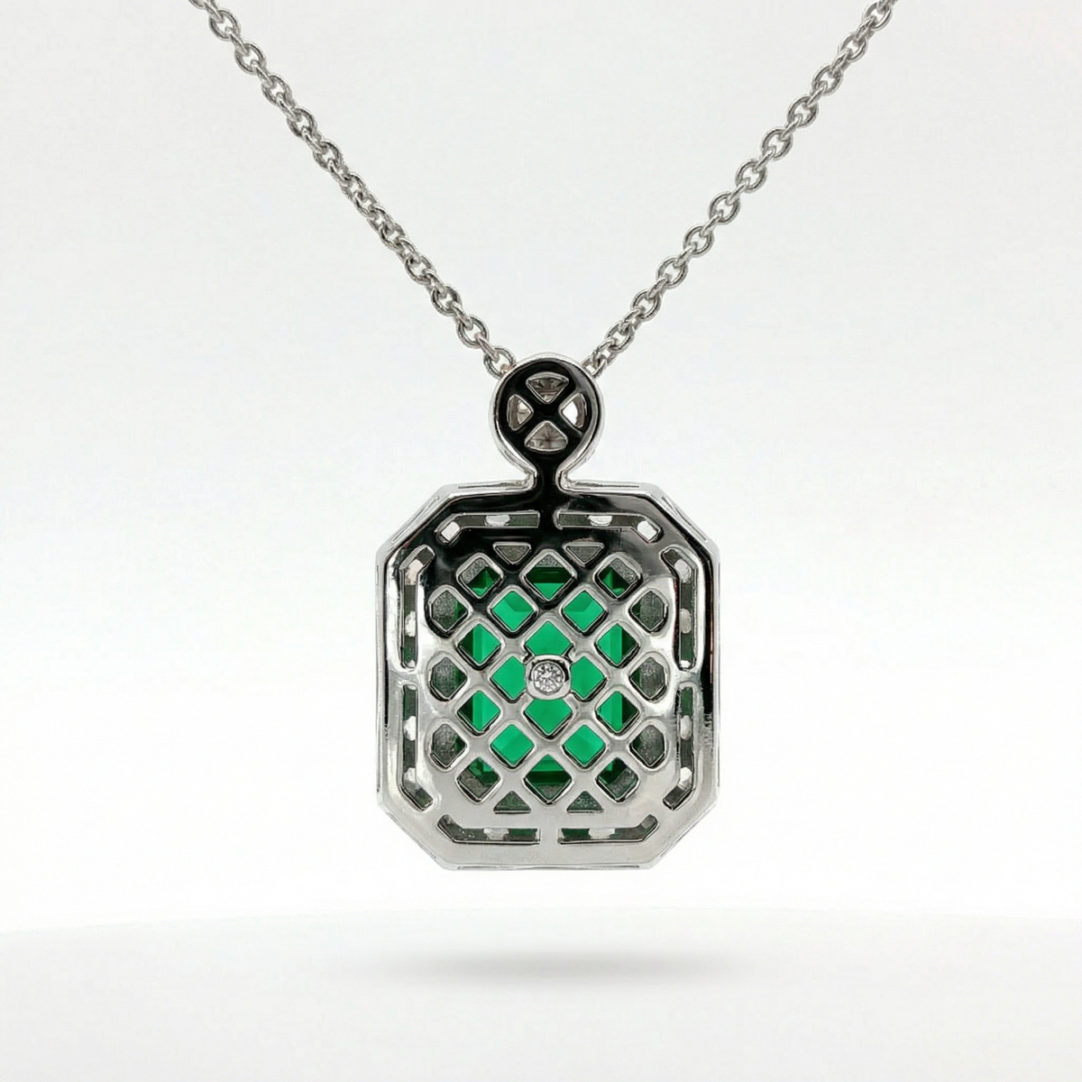 Emerald and Diamond Charm Necklace in White Gold Plated Silver
