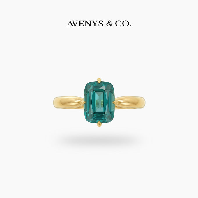 Modern Solitaire Cocktail Ring with Blue Cushion Stone – on Yellow Gold