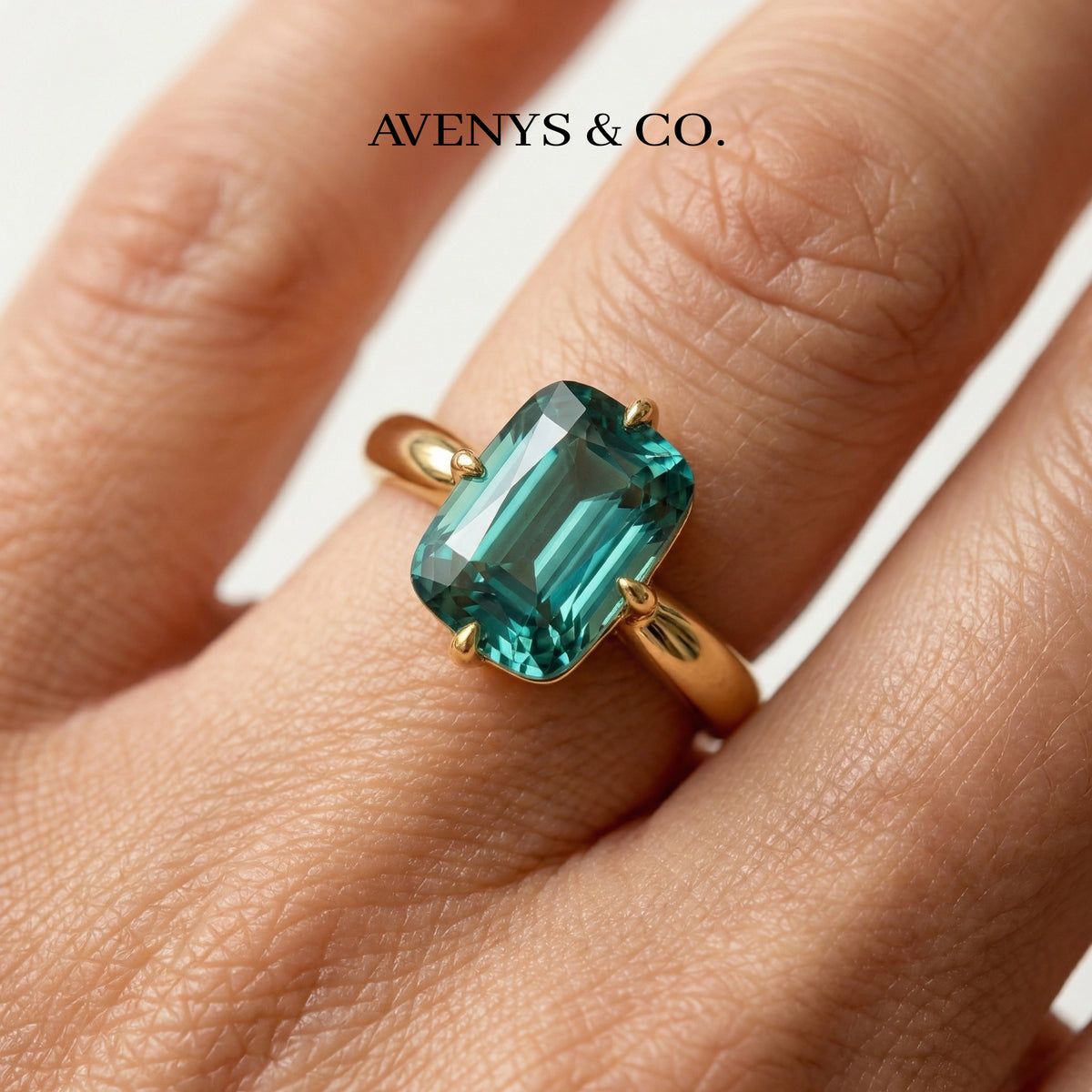 Modern Solitaire Cocktail Ring with Blue Cushion Stone – on Yellow Gold