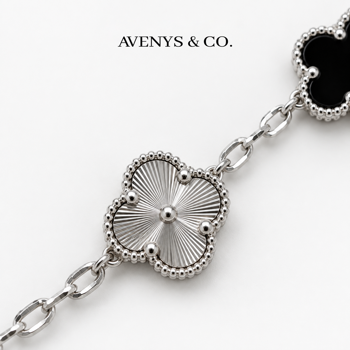 AV Bloom™ silver sunburst engraving and beaded motif detail