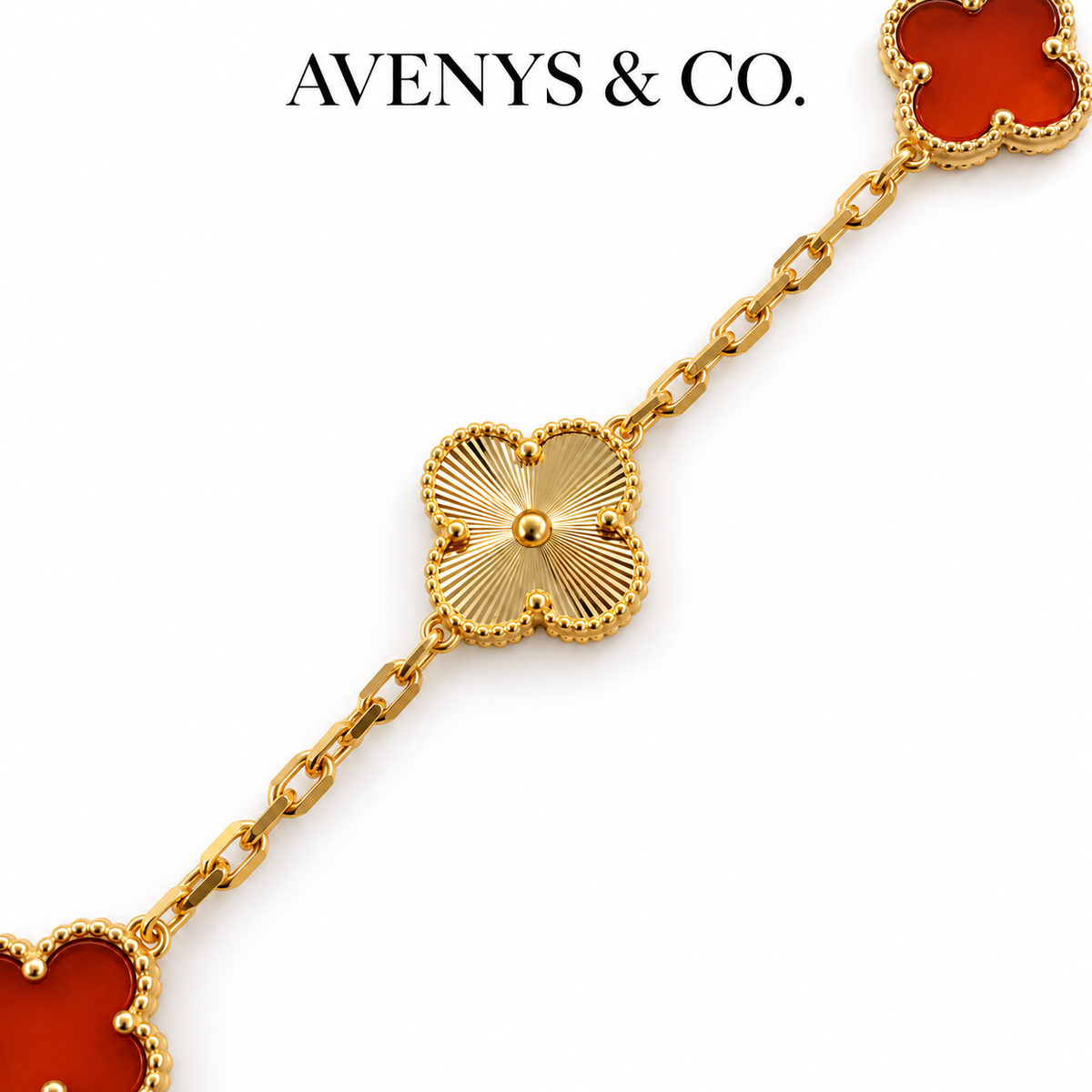 Gold sunburst engraving and flat faceted chain detail