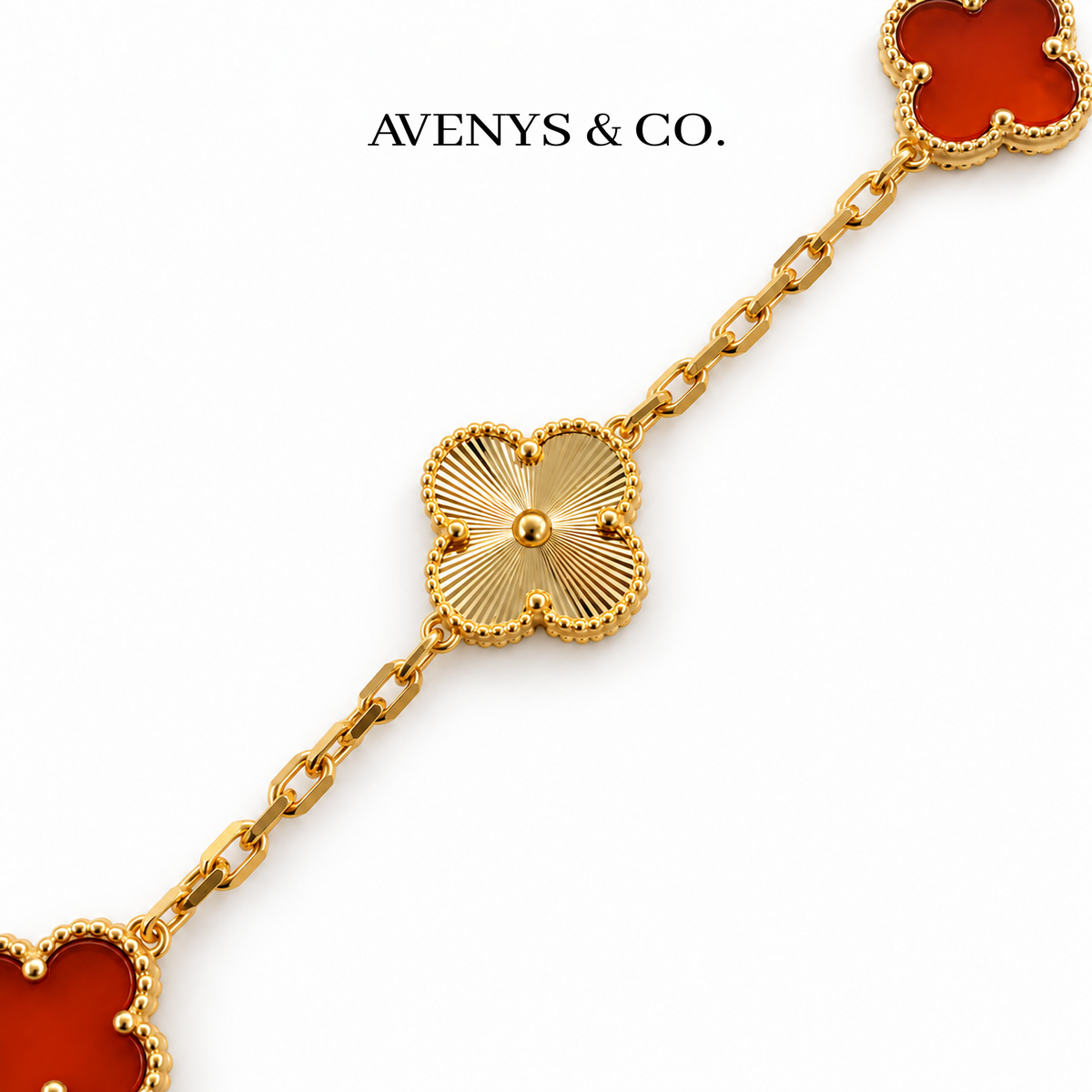 Gold sunburst engraving and flat faceted chain detail